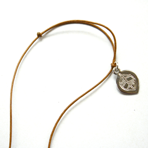 Cord and metal tag close up